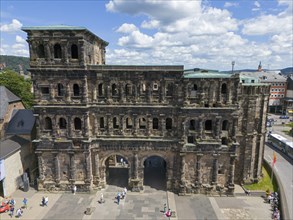 Historical architecture with detailed masonry, Porta Nigra in Germany in sunny summer weather,