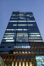 Low-angle view of Park Silom Office Building at night, Bangkok, Thailand, Asia