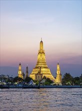 Wat Arun Temple lit up at night, Bangkok, Thailand, Asia