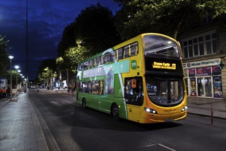 A night bus in O'Connell Street with the Spire in the background. Dublin, Ireland, Europe