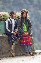 Vietnamese woman selling flowers in the northern mountains, Ha Giang province, Vietnam, Asia