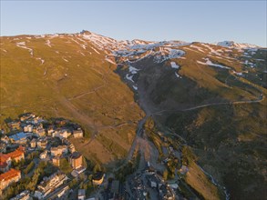 Aerial view of a snow-covered mountain resort at dusk, aerial view, Pradollano, Pico Veleta