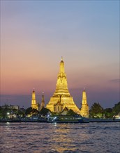 Wat Arun Temple lit up at night, Bangkok, Thailand, Asia