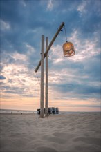 Wooden lantern on the beach at sunset, Zandvoort, Netherlands