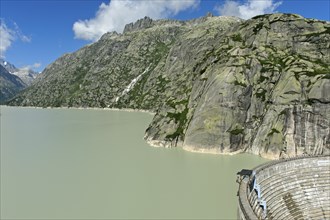 The well-filled Grimselsee reservoir with the Spitallamm wall, Guttannen, Canton Bern, Switzerland,