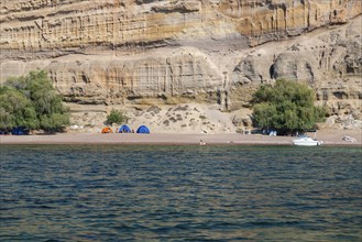 Campers, tents at Red Sand Beach near Stegna, Rhodes, Dodecanese, Greece, Europe