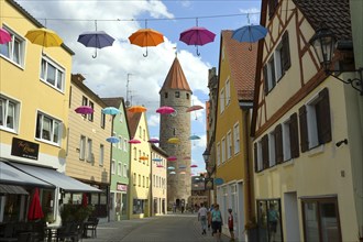 FÃ¤rberturm also called Pulverturm, coloured umbrellas in the sky, Gunzenhausen, Altmühltal,