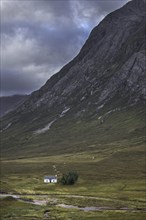 The remote Lagangarbh Hut along River Coupall in front of Buachaille Etive Mor in Glen Coe on a