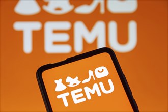 Temu logo online marketplace online trading ecommerce on a mobile phone and computer screen