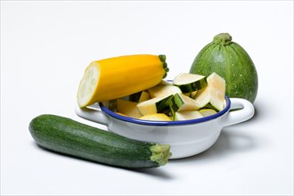 Various courgettes (Cucurbita pepo), courgettes cut up in pot convar. giromontiina