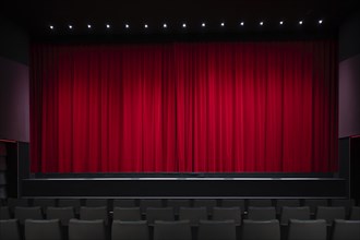 Interior shot, red velvet curtain in a cinema, theatre, rows of seats, Stuttgart,