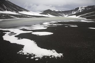 Mountains and lake in caldera of active volcano on Deception Island, South Shetland Islands,