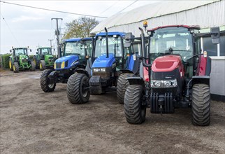 Row of tractors in farm machinery auction sale, Campsea Ashe, Suffolk, England, UK