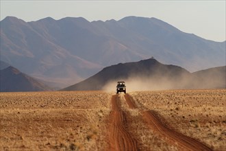 A jeep in the landscape, Namibia, Africa