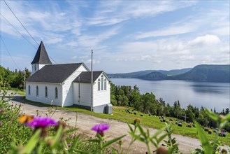 White wooden St Ambrose Church overlooking the Atlantic Ocean, Corner Brook, Bay of Islands,