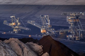 Lignite excavators extract coal in the Welzow open-cast mine, operated by LEAG. The lignite is