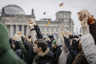 People hold hands at the large demonstration against the right in Berlin under the slogan We are