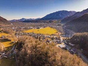 Aerial view of a town with surrounding fields and mountains in the background, Bad Reichenhall,