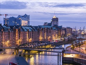 Aerial view of Speicherstadt Hamburg and the Elbe Philharmonic Hall with customs canal at blue