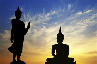 Two Buddhas in Thailand, silhouettes in front of sunset, Ko Samui, Koh Samui