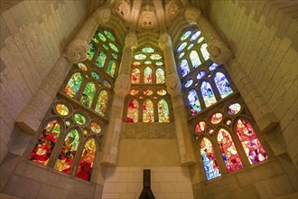 Colourful stained glass windows in side chapel, Sagrada Familia, Basilica by Antoni Gaudi,