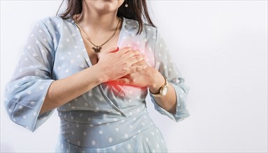 Unrecognizable woman with chest pain isolated. Girl with heart pain on isolated background. Concept