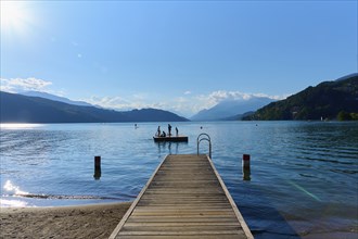 Lake shore, wooden jetty, bathing raft, bathers, sun, evening, summer, Lake Millstatt, Döbriach,