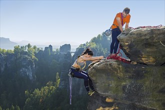 Climbers in Rathen in Saxon Switzerland