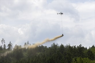 Symbolic image, climate change, helicopter, helicopter spreading fine-painted limestone and ash