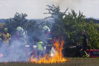 During controlled field fires, the firefighters were able to test various extinguishing methods,