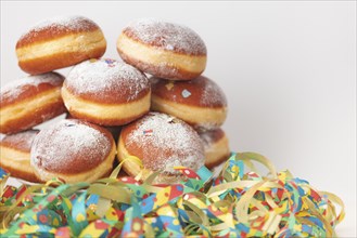 Colourful streamers and doughnuts, carnival, copy room, white background