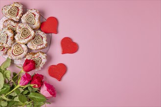 Heart-shaped cupcakes, red hearts and roses, Valentine's Day, pink background