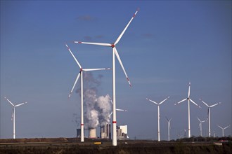 Wind turbines at the Garzweiler open-cast lignite mine with the Neurath power station in the