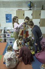 Pupils in a classroom in one of the metro schools in Kharkiv. Classrooms were set up in various