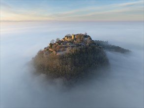 Aerial view of the Hegau volcano Hohentwiel with the upper fortress ruins illuminated by the rising