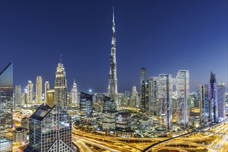 Burj Khalifa skyline tallest building in the world from above in Downtown at night in Dubai, United