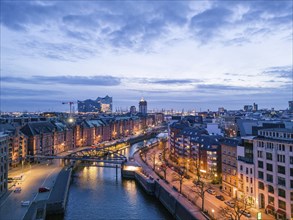 Aerial view of Speicherstadt Hamburg and the Elbe Philharmonic Hall with customs canal at blue