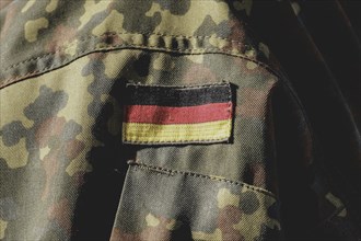 German flag on the clothing of a soldier, taken during the military exercise 'Wettiner Schwert'