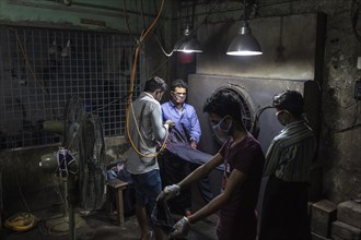 Worker in a denim dyeing factory, textile industry, Dhaka, Bangladesh, Asia