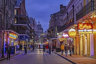 Bars and pizza restaurants at night in Bourbon Street, French Quarter, Vieux Carré in the city New