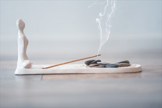 Burning aromatic incense stick for yoga and meditation. Calmness