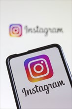 Instagram logo social media on a mobile phone and computer screen