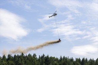 Symbolic image, climate change, helicopter, helicopter spreading finely painted limestone and wood