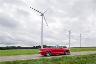 Wind farm, wind turbine, wind turbines, country road, car, convertible, Baden-Württemberg, Germany,