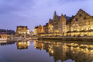 Medieval guild houses of Graslei Kai on the river Leie at dusk, Ghent, Belgium, Europe