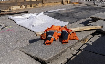 Work clothes in red, construction site in Berlin, Germany, Europe