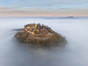 Aerial view of the Hegau volcano Hohentwiel with the upper fortress ruins illuminated by the rising