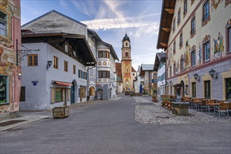 Bell tower of the parish churches of St Peter and St Paul, house façades with air frescoes,