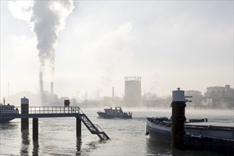 Jetty at the BASF site on the banks of the Rhine, chemical company, police boat, foggy mood,