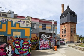 Graffiti at the Schlachthof cultural centre with heritage-protected water tower, subculture,